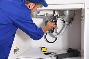 Licensed plumber repairing a drain in Dearborn, Michigan